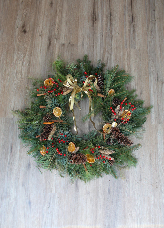 christmas wreath, rustic wreath, orange slices, pinecones, red berries, cinnamon