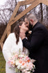 bride and groom and wedding flowers by B's Flowers LLC, Gasport, NY
